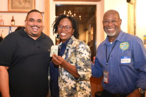 St. Croix Chamber of Commerce Business After Hours 50/50 Raffle Winner with Chamber Chair Akeel St Jean and Dept of Labor Commissioner Gary Molloy